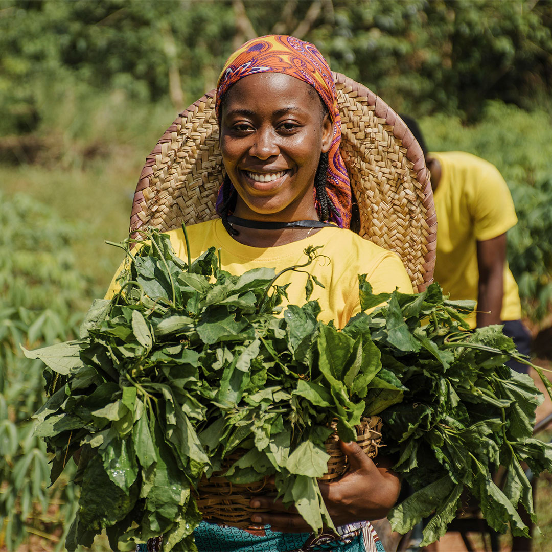 A farmer with her harvest